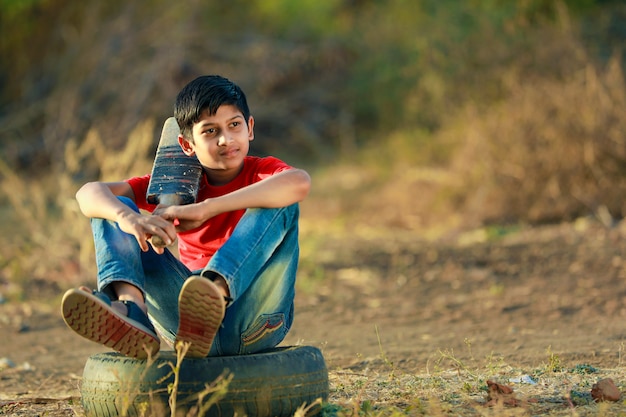 Rural Indian Child Playing Cricket