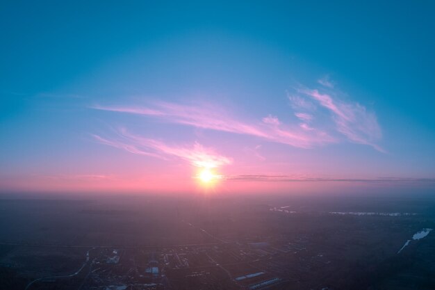 Rural landscape in the morning with the bluepink sky aerial view of the countryside during sunrise