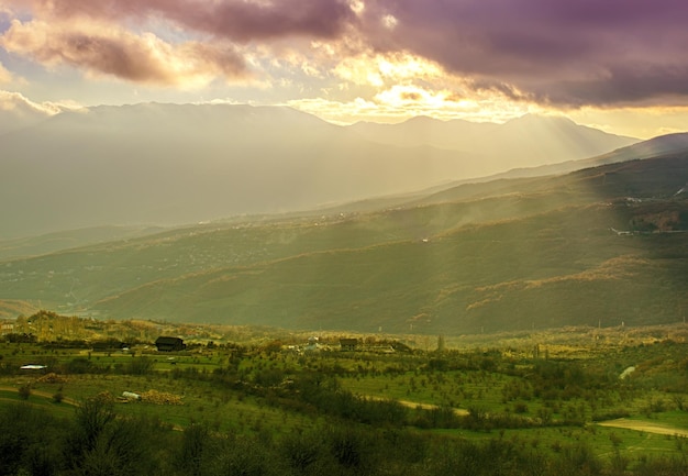 Rural landscape with sun rays