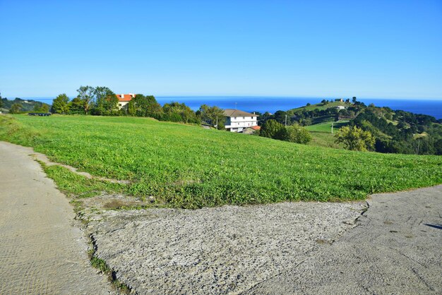 Rural road through the village along the ocean coast The Northern Way of St James Spain