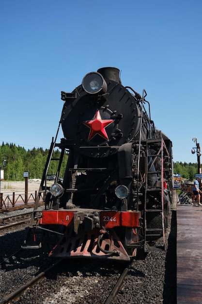 Ruskealsky express front view soviet retro steam powered train
stands at railway station