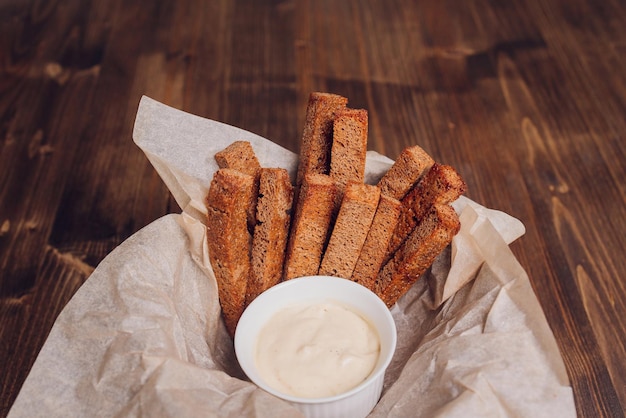 Rusks with leek sauce on a wooden old tablebeer appetizer and a great addition to the first dishes n