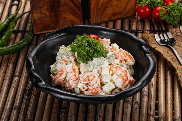 Russain mayonnaise salad with prawn potato carrots and green peas