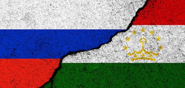 写真 ロシアとタジキスタンの旗の背景外交と政治的紛争と競争のパートナーシップと協力のコンセプト写真