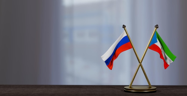 Russia and Equatorial Guinea flags on table Negotiation between Equatorial Guinea and Russia on little blur background 3D work and 3D image