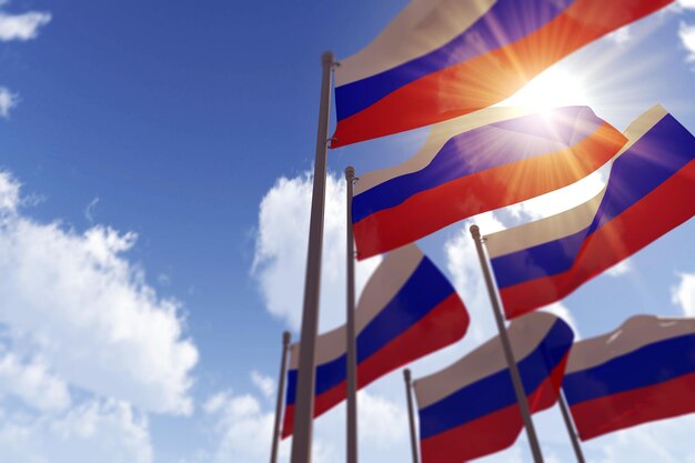 Russia flags waving in the wind against a blue sky d rendering