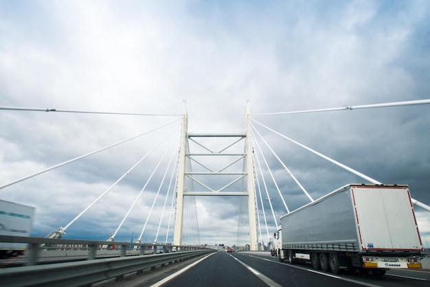 Russia St Petersburg August 2021 Cars are driving along the Expressway automobile ring road and the bridge over the bay