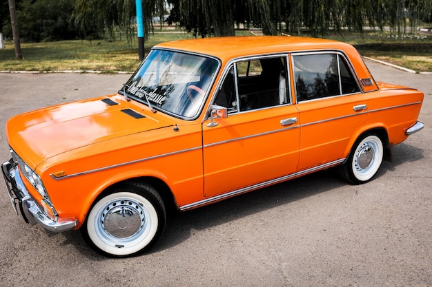 Russia tambov 11072009 front view of the russian classic car\
lada auto red soviet car on the streets the front of the car