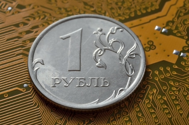 Russian 1 ruble coin lies among the microcircuits a concept illustrating the pricing of electronics in Russia