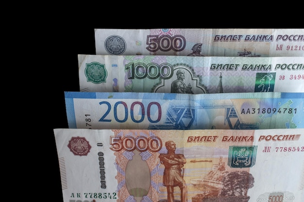 Russian banknotes on a black background.