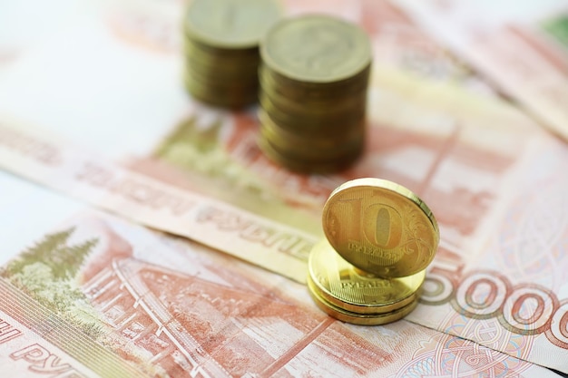 Russian banknotes and coins "rubles." Banknote with the inscription "five thousand rubles" and coins of 5 and 10 rubles. Background made of money.