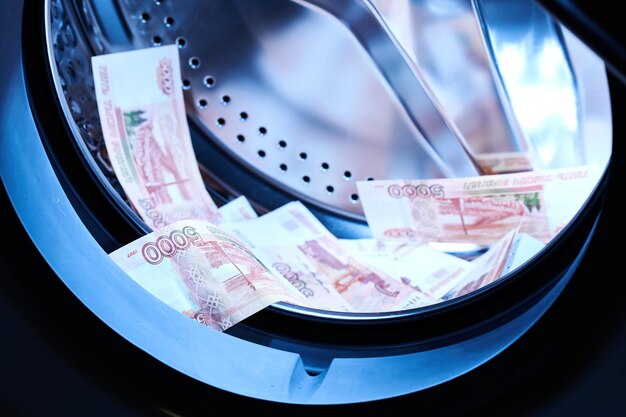 Russian banknotes in the washing machine Money laundering financial fraud concept