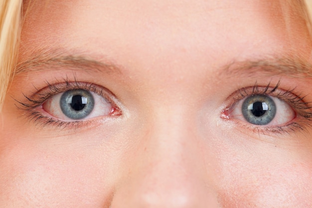 Russian-born woman with blue eyes closely