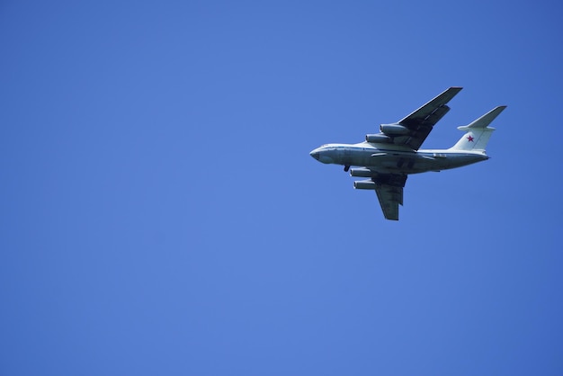 Russian cargo plane comes in for landing against the blue sky