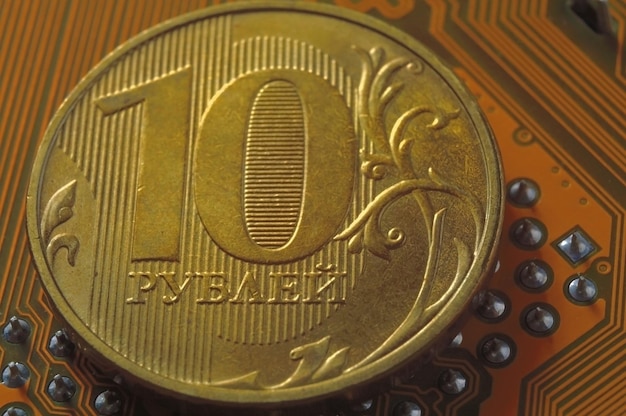 Russian coin with a face value of 10 rubles lies on the surface of the microcircuit the concept of the digital economy of Russia