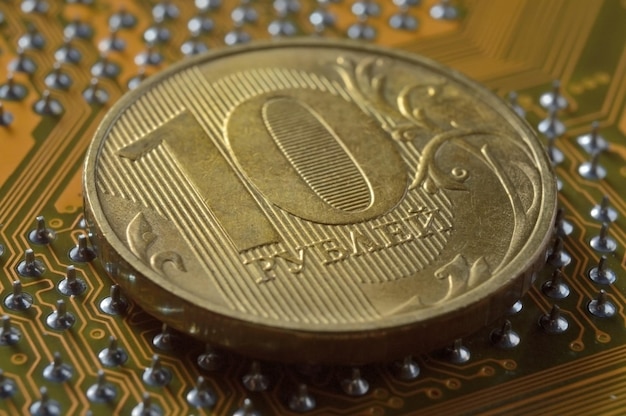 Russian coin with a face value of 10 rubles lies on the surface of the microcircuit the concept of the digital economy of Russia