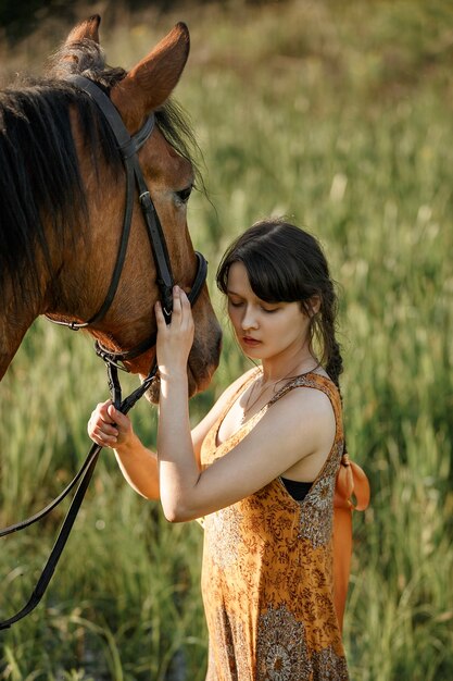 Russian girl on a horse, spring nature, man and animal