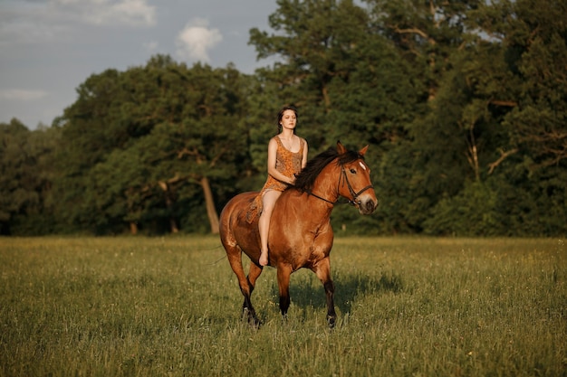 Russian girl on a horse, spring nature, man and animal