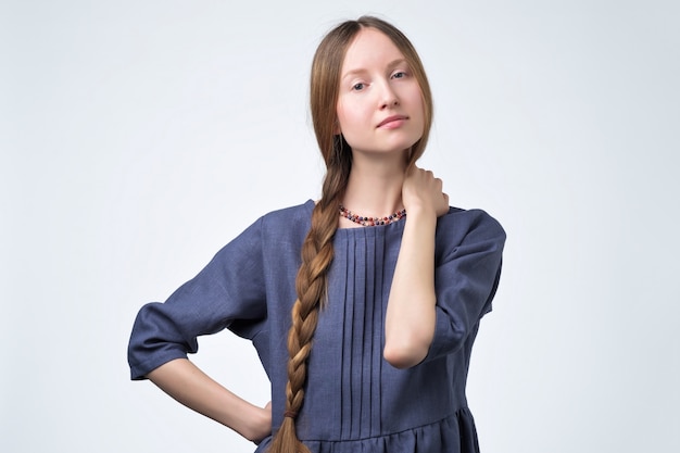 Russian girl with braid hair, smiling with confident and friendly look