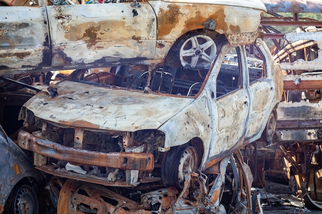 Russian invasion of Ukraine in 2022 destroyed and burned cars Cars were beaten with shrapnel and burned Irpensky automobile cemetery The consequences of the war in a peaceful city near Kyiv