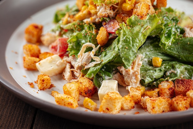 Russian malibu salad with croutons and ham