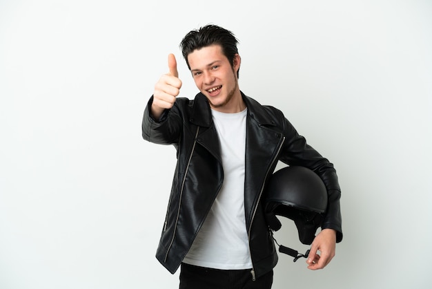 Russian man with a motorcycle helmet isolated on white background with thumbs up because something good has happened