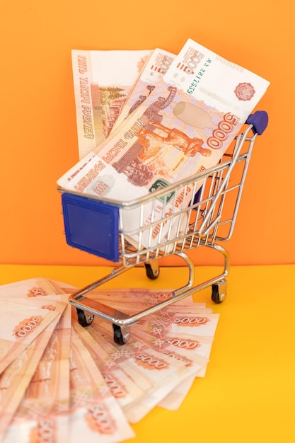 Russian money in shopping cart banknotes of russian rubles cash currrency banknotes bank russia weal