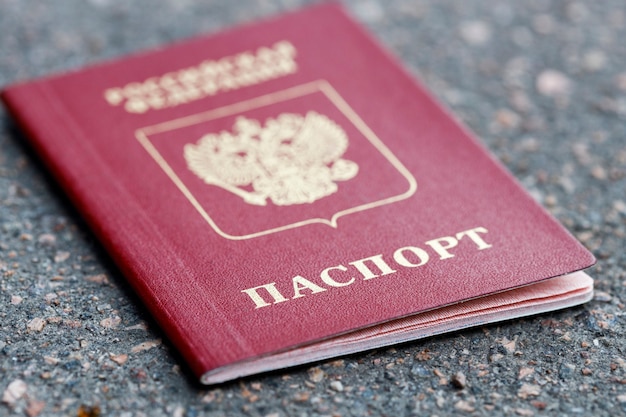 Russian passport lies on the tarmac in the city. High quality photo