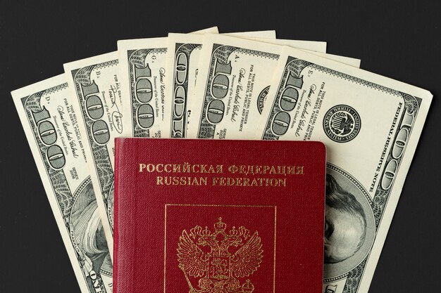 Russian passport with US dollar banknotes inside