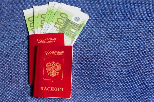 Russian passports with Euro currency on blue background