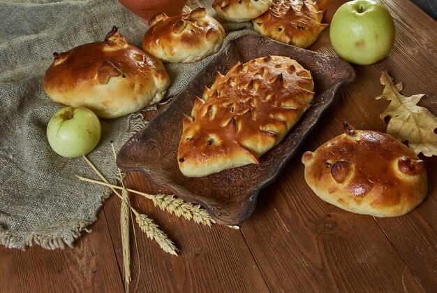 Russian pies traditional cabbage and meat in the form of figures of a hedgehog and pig