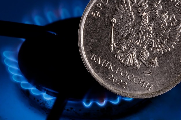 Russian ruble coin on the background of a gas burner High quality photo