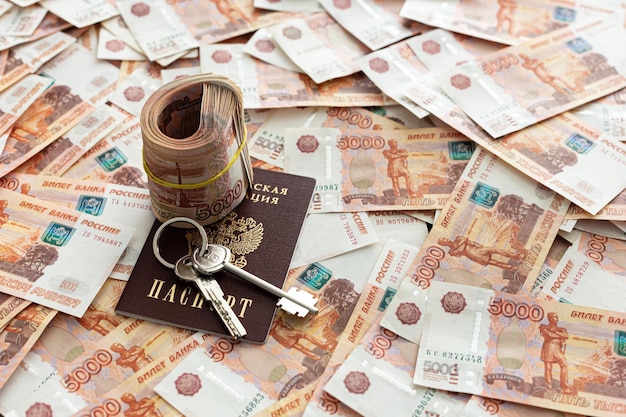 Russian rubles cash are on the desk in the office The nominal value is 5000 rubles Keys and passport