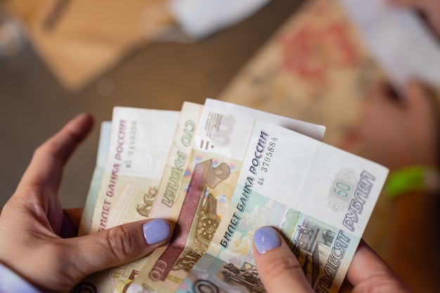 Russian rubles in the hand of a fan.male hand holding many of the Russian banknotes.The transfer of money.The isolated five-thousandth of Russian rubles denominations in a hand.