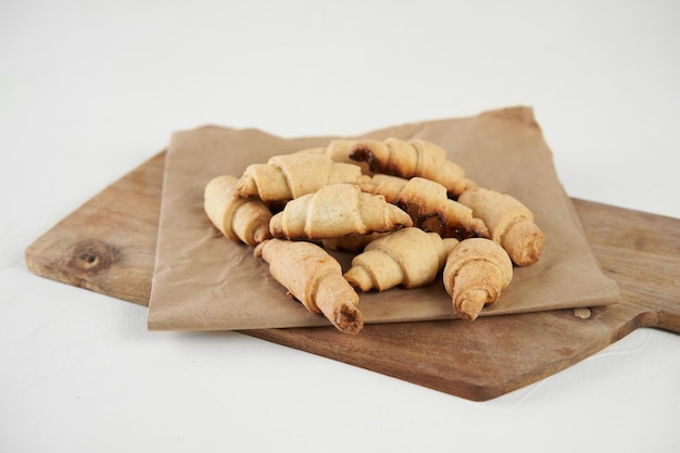 Russian slavic traditional pastry called roguelikes Cakes bagels Crispy croissants Food on white background Copy space