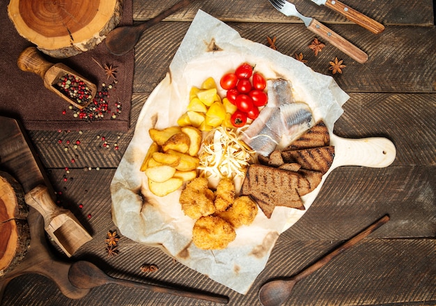 Russian snack set with herring and vegetables