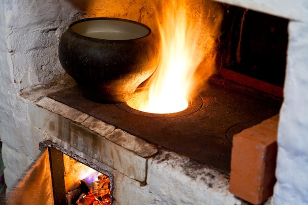 Photo russian stove and old castiron pot