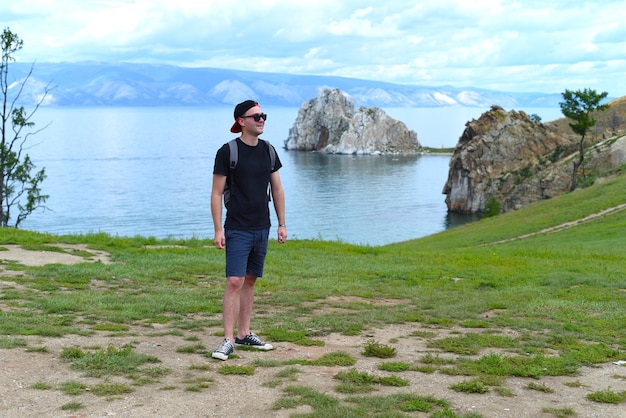 Russian tourist near holy place among shamans Shamanka