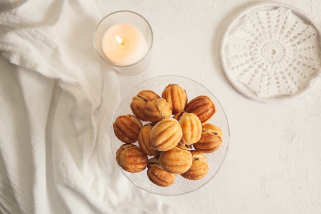 Russian traditional homemade cookies Nuts with condensed milk on a glass stand.