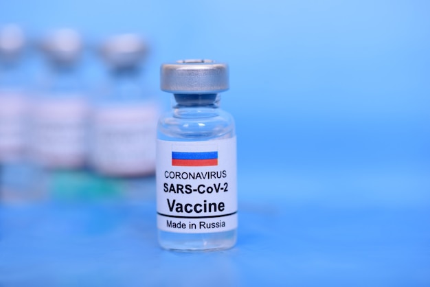 Russian vaccine and Healthcare Medical concept. Vaccines on blue background for prevention,immunization and treatment from corona virus infection