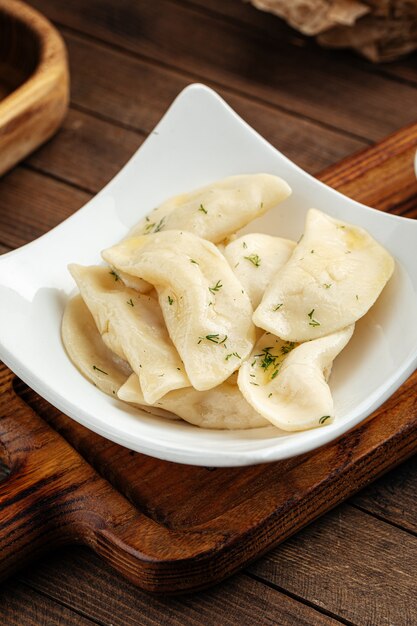 Russian vareniki dumplings with sour cream