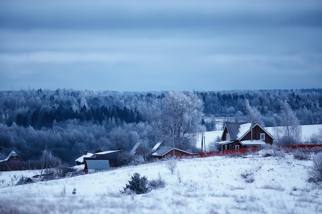 Russian village in winter, landscape in January snowfall, village houses