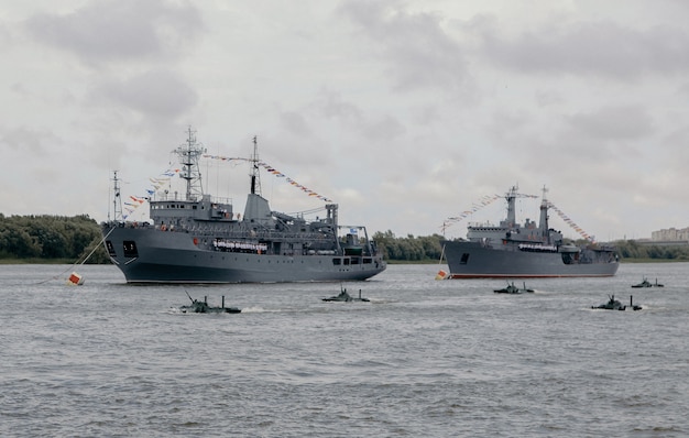 Russian warships in Volga river in Astrakhan in summer at cloudy day. Russian Military vessels.