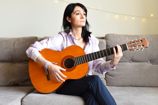 Russian woman playing guitar