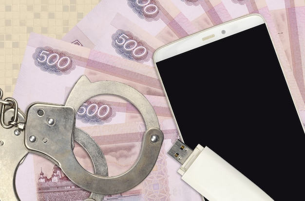 Russische roebelsrekeningen en smartphone met politiehandboeien