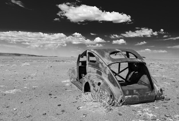Rusted abandoned car wreck in the desert