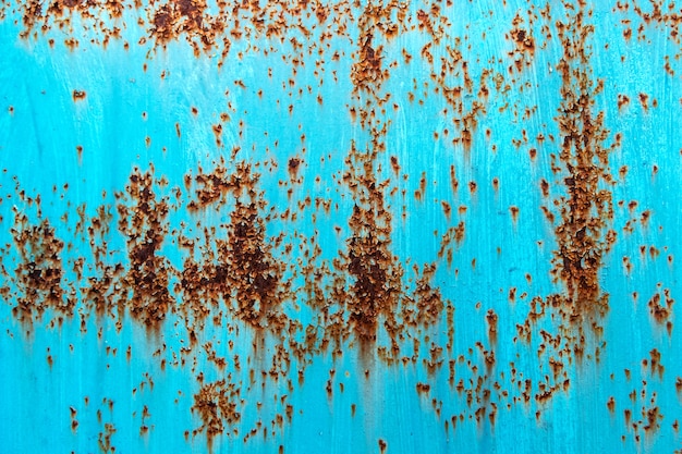 Rusted blue painted metal background. Grunge texture template for overlay artwork.