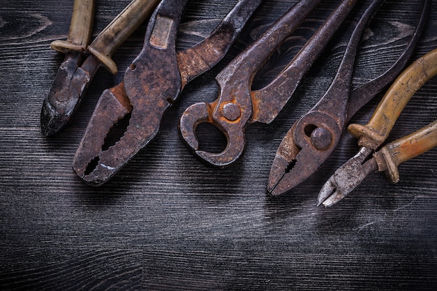 Rusted vintage tools on dark table