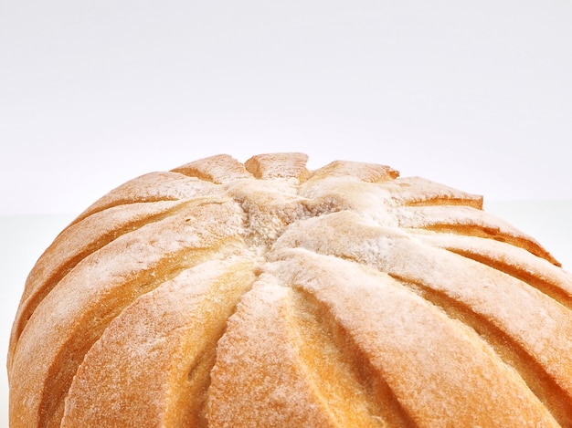 Rustic bread ball in basket French Ball on white background