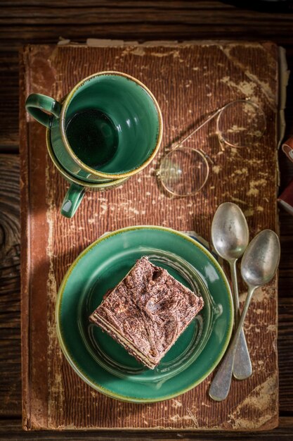 Rustic cake and coffee on desk writer